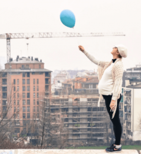 Pregnant person with blue balloon Metro Nashville Public Schools' Direct Contract
