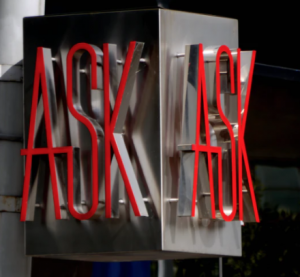 The word "Ask" in bright red neon, ask anything about reference-pricing